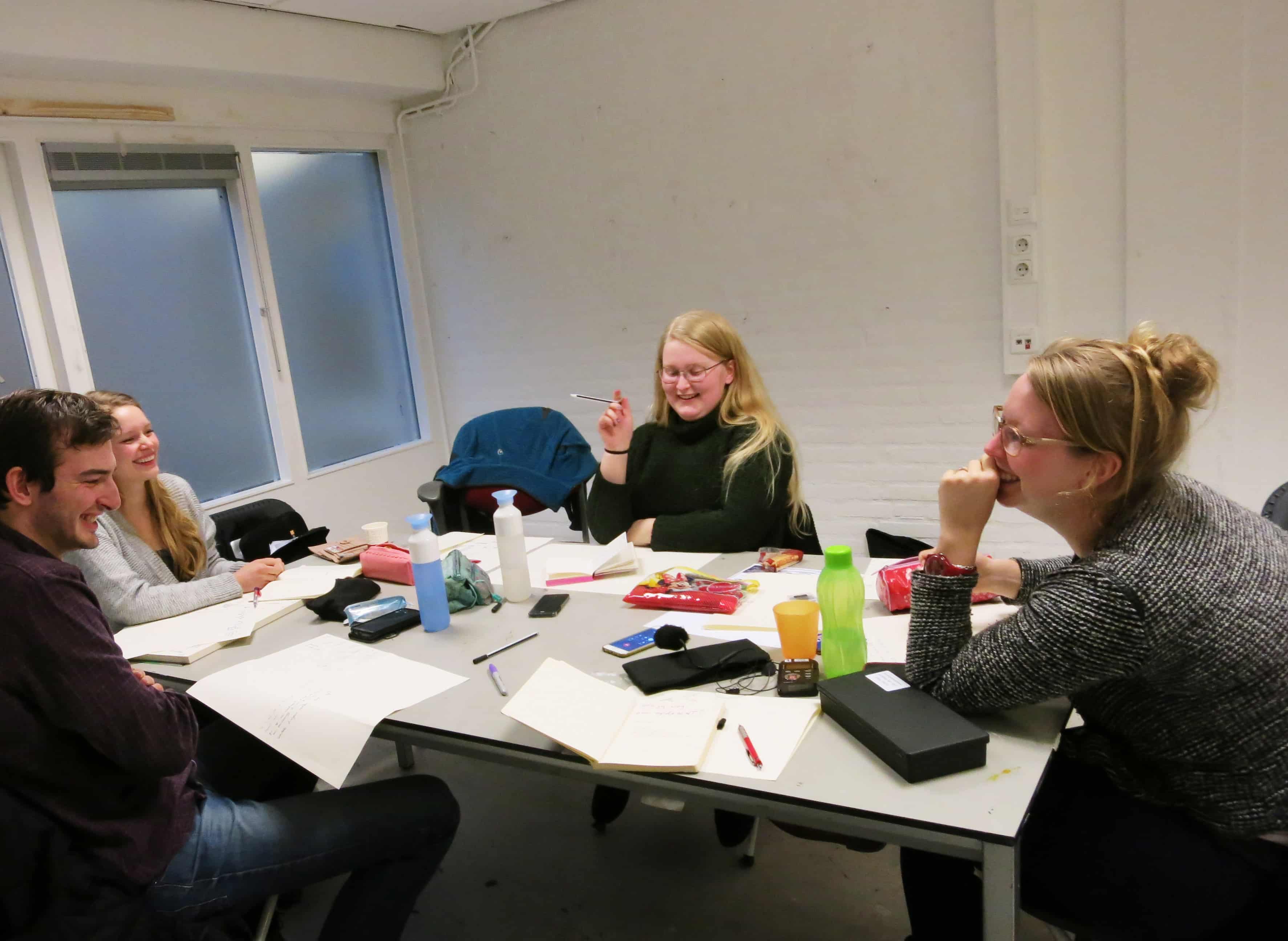The group is listening, via phone, to the person walking outside in the Workshop Lines Inscribed